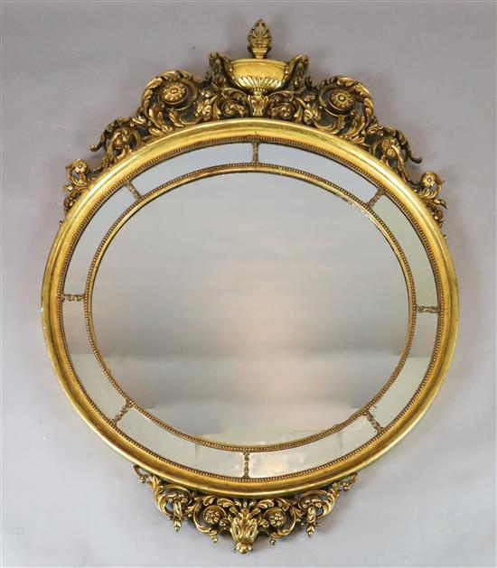 A mid 20th century carved giltwood wall mirror, W.3ft 9in. H.4ft 8in.